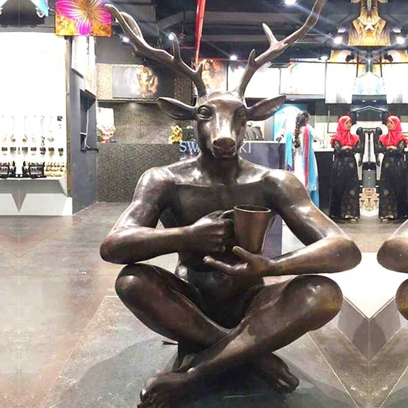 Man with Deer Head Statue